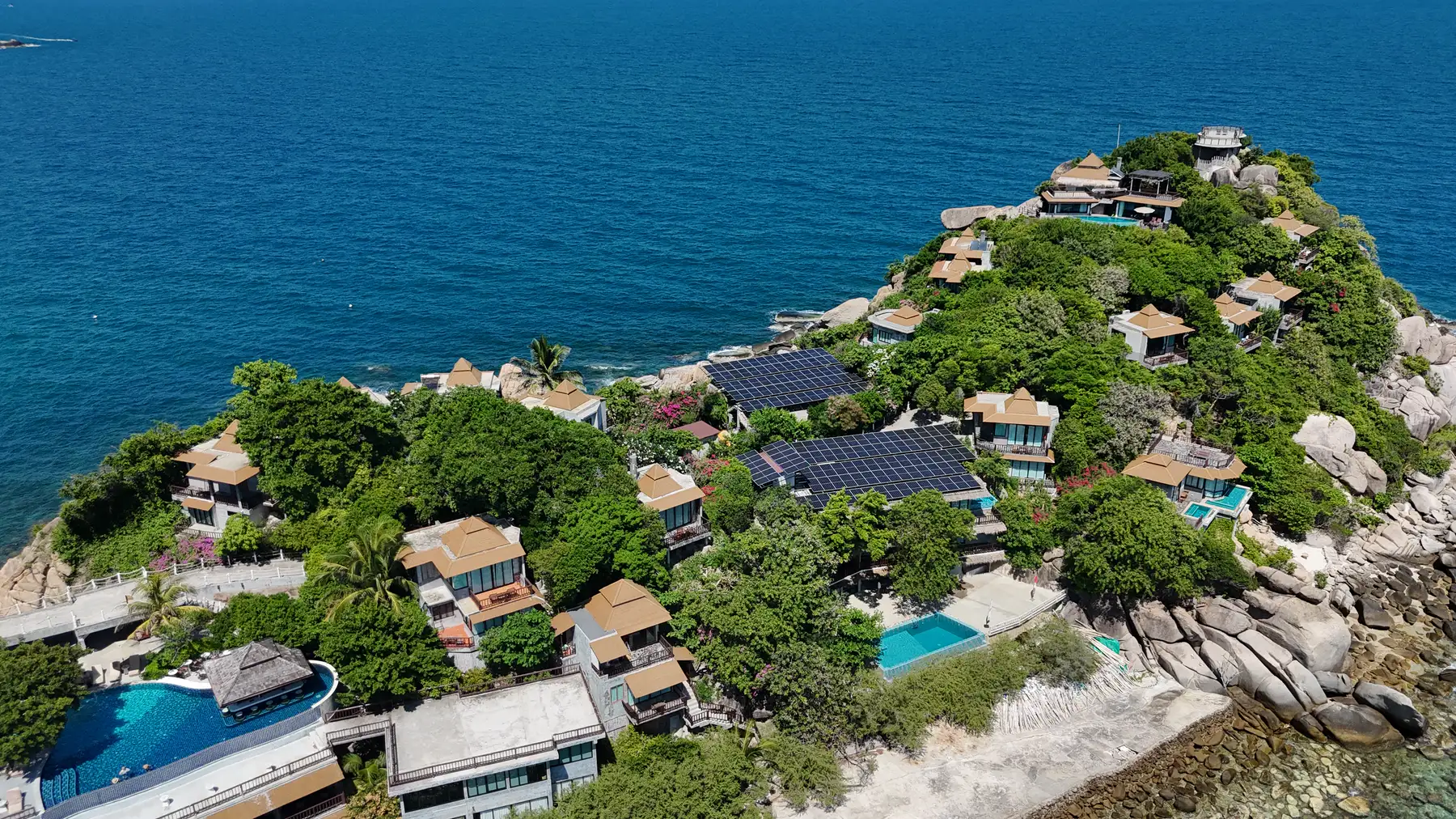The resort's villas on the headland, with the sea behind